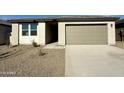 Single-story house with a two-car garage and desert landscaping at 2338 E Wagon Wheel Ln, San Tan Valley, AZ 85140