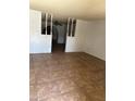 Spacious living room with tile floors and a view to the kitchen at 6440 W Mcdowell Rd, Phoenix, AZ 85035