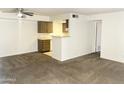 Open living room with view of kitchen and hallway at 4608 W Maryland Ave # 144, Glendale, AZ 85301