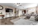 Spacious living room featuring tile floors and a comfortable sectional sofa at 3760 W Roberts Rd, San Tan Valley, AZ 85144