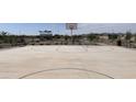 Community basketball court with playground and benches nearby at 24248 W Bowker St, Buckeye, AZ 85326