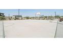 Community basketball court with playground in background at 24248 W Bowker St, Buckeye, AZ 85326
