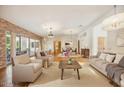 Bright living room with hardwood floors, comfortable seating, and large windows at 5302 E Mercer Ln, Scottsdale, AZ 85254