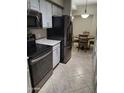 Modern kitchen with stainless steel appliances and light-colored cabinetry at 14950 W Mountain View Blvd # 1111, Surprise, AZ 85374