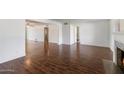 Spacious living area featuring hardwood floors and views into adjacent rooms at 845 W Edgemont Ave, Phoenix, AZ 85007