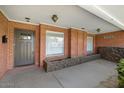 Brick entryway with gray door and planter boxes at 845 W Edgemont Ave, Phoenix, AZ 85007