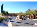 Gated community entrance with a sign and desert landscaping at 17025 E La Montana Dr # 107, Fountain Hills, AZ 85268