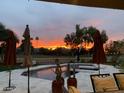 Inviting pool area with sunset view and comfortable seating at 8233 E Foothill Cir, Scottsdale, AZ 85255