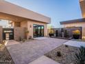 Private courtyard with water feature, potted plants, and access to multiple rooms at 37200 N Cave Creek Rd # 1005, Scottsdale, AZ 85262