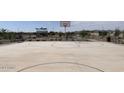 Outdoor basketball court with benches and landscaping at 24232 W Bowker St, Buckeye, AZ 85326