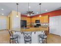 Kitchen with a large island and granite countertops at 42609 W Milky Way, Maricopa, AZ 85138