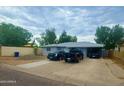 Ranch style home with carport and spacious yard at 5919 W Marlette Ave, Glendale, AZ 85301