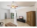 Bright living room featuring tile floors and ceiling fan at 9925 E Adobe Rd, Mesa, AZ 85207