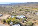 Aerial view of a house on a large lot with desert landscape and mountain views at 50644 N 33Rd Ave, New River, AZ 85087