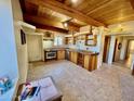 Kitchen with wooden cabinets and stainless steel appliances at 50644 N 33Rd Ave, New River, AZ 85087