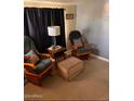 Relaxing living area with rocking chairs and ottoman at 2701 E Allred Ave # 68, Mesa, AZ 85204