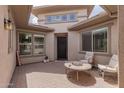 Cozy courtyard with seating area and fire pit at 10005 W Spur Dr, Peoria, AZ 85383