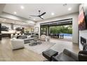 Open concept living room with sliding doors to backyard at 8742 E Woodley Way, Scottsdale, AZ 85266