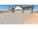 Large driveway leading to a two-car garage at 1606 E Minton St, Mesa, AZ 85203
