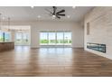Spacious living room with fireplace and sliding glass doors at 1606 E Minton St, Mesa, AZ 85203