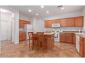 Bright kitchen with an island and ample cabinetry at 14623 W Hearn Rd, Surprise, AZ 85379