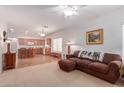 Open living room with a view into the kitchen at 14623 W Hearn Rd, Surprise, AZ 85379