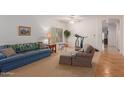 Cozy living room featuring a blue couch and comfortable seating at 14623 W Hearn Rd, Surprise, AZ 85379