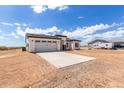 New construction home; features two-car garage and desert landscaping at 33 N 375Th Ave, Tonopah, AZ 85354