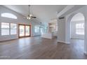Open concept living area with kitchen and pool views at 9859 W Potter Dr, Peoria, AZ 85382