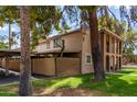 Two-story building with parking and a fenced yard at 7126 N 19Th Ave # 173, Phoenix, AZ 85021