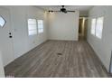 Bright living room with gray vinyl flooring at 7300 N 51St Ave # 160, Glendale, AZ 85301