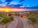 Luxury home nestled on a hillside with scenic sunset views at 3518 N Shadow Trl, Mesa, AZ 85207