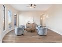 Elegant sitting area with hardwood floors and large windows with hill views at 3518 N Shadow Trl, Mesa, AZ 85207