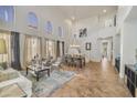 Spacious living room with high ceilings,tile floors, and ample natural light at 6251 S Moccasin Trl, Gilbert, AZ 85298