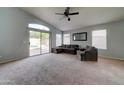 Spacious living area with comfortable couches and backyard access at 3128 E Millbrae Ln, Gilbert, AZ 85234