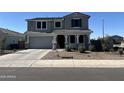 Two-story house with gray exterior, landscaping, and a two-car garage at 7322 S Briarwood Ln, Gilbert, AZ 85298