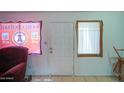 Simple entryway with tile floors and a door at 6842 W Devonshire Ave, Phoenix, AZ 85033