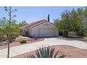 Detached garage with a landscaped driveway at 2825 W Pinto Pl, Wickenburg, AZ 85390