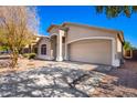 Single story home with two car garage and mature trees at 8609 S 49Th Dr, Laveen, AZ 85339