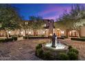 Elegant home with a central courtyard and fountain at 10719 E Rimrock Dr, Scottsdale, AZ 85255
