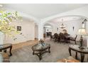 Formal dining room with a chandelier and access to kitchen at 10748 E Sunflower Ct, Florence, AZ 85132