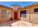 Private courtyard entry with red front door at 9985 E Legend Ct, Gold Canyon, AZ 85118