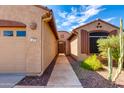 Front entry with stone walkway and desert landscaping at 9985 E Legend Ct, Gold Canyon, AZ 85118