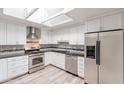 Modern kitchen with stainless steel appliances and granite countertops at 3708 E Joan De Arc Ave, Phoenix, AZ 85032