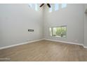 Bright living room with high ceilings and hardwood floors at 1860 W Buckhorn Trl, Phoenix, AZ 85085