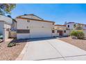 Front view of a charming two-story home with a two-car garage at 1023 E Escuda Dr, Phoenix, AZ 85024
