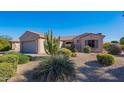 Single-story home with desert landscaping and two-car garage at 19661 N Echo Rim Dr, Surprise, AZ 85387