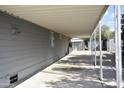 Covered patio area with concrete flooring and a view of a detached garage at 17836 N 21St St, Phoenix, AZ 85022