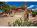Front exterior view of a charming single-story home with a two-car garage at 930 Leisure World --, Mesa, AZ 85206