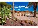 Front exterior view of a charming single-story home with a two-car garage at 930 Leisure World --, Mesa, AZ 85206